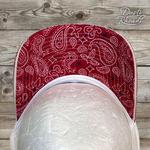Dusti Rhoads Howdy Highlander Patch Trucker Cap.