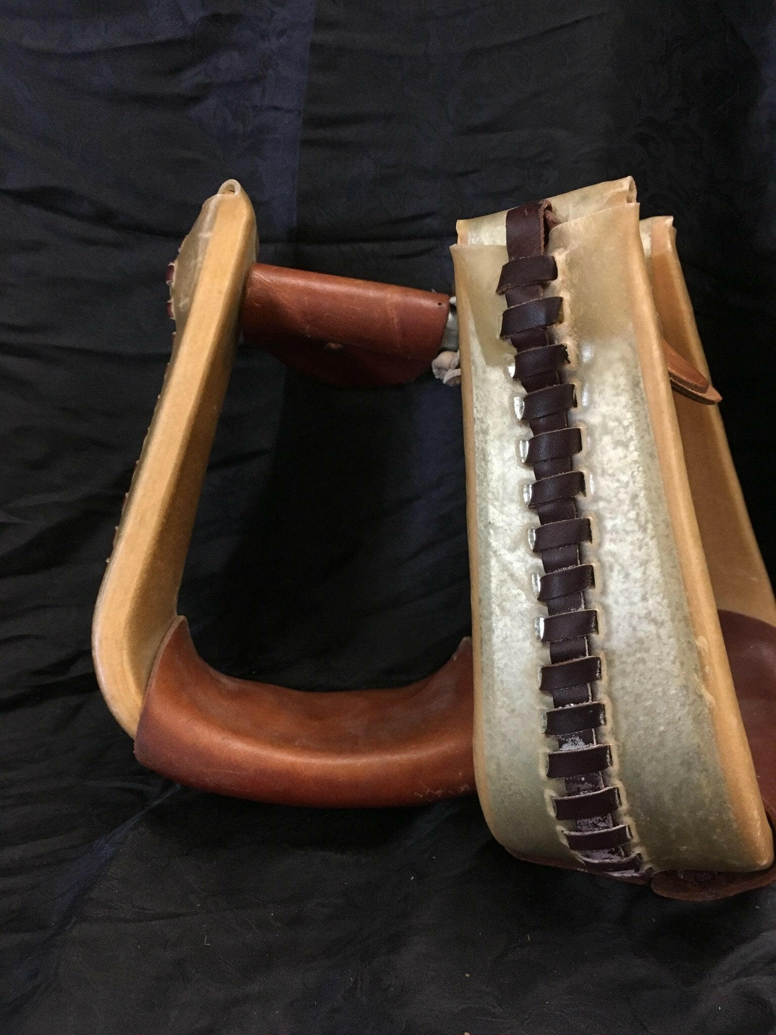 Rawhide Covered Metal Roper Stirrups.