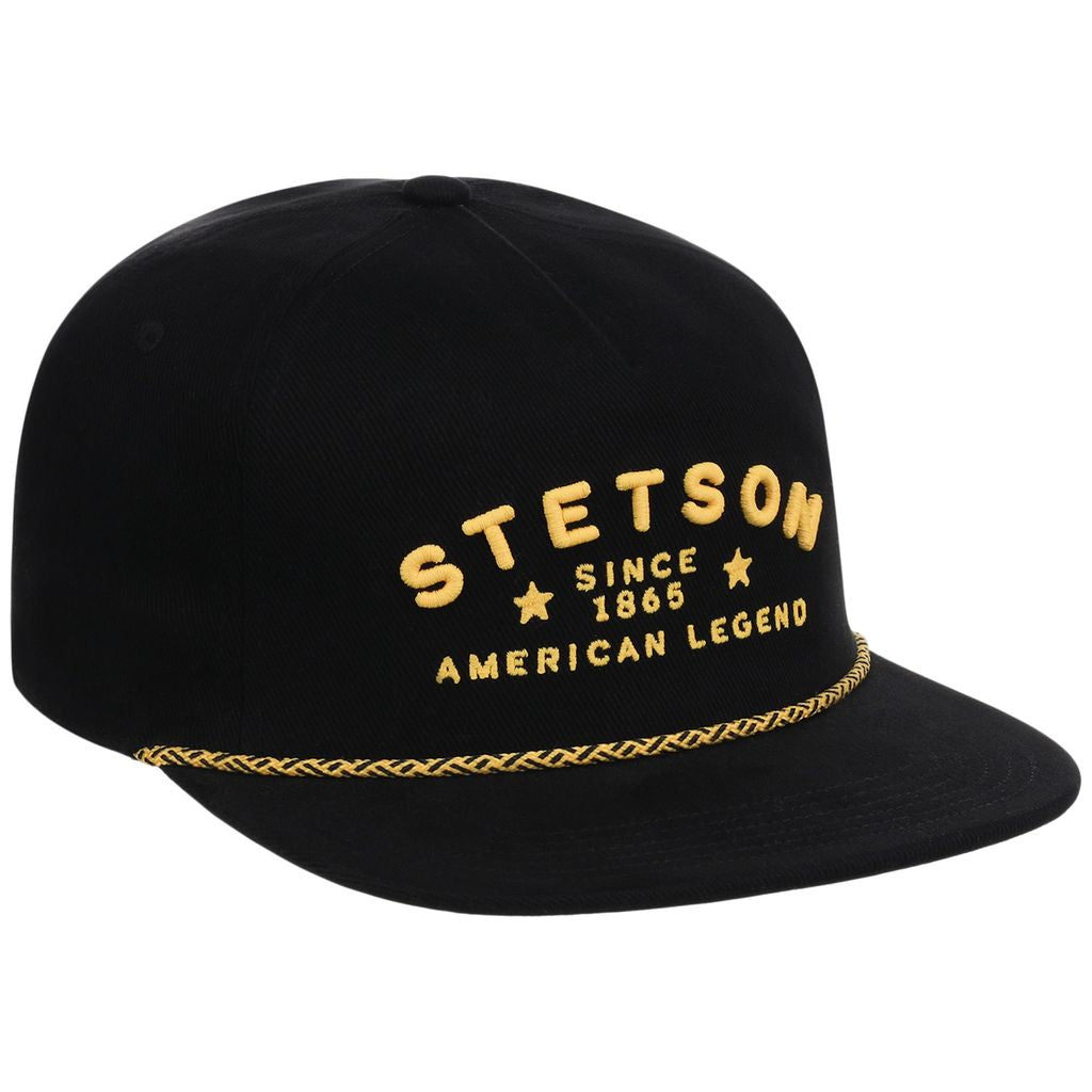 Black cap with yellow text and braided rim on a white background